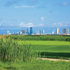 Seaview Bay Course with Atlantic City skyline in view.