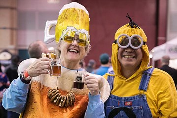 Two people in costumes holding beer tastings at the Atlantic City Beer and Music Festival